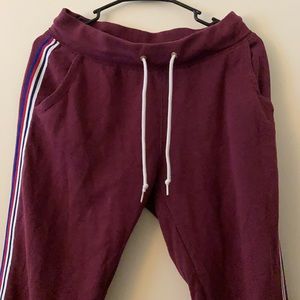 Maroon sweat pants with blue-white-red down the sides.
